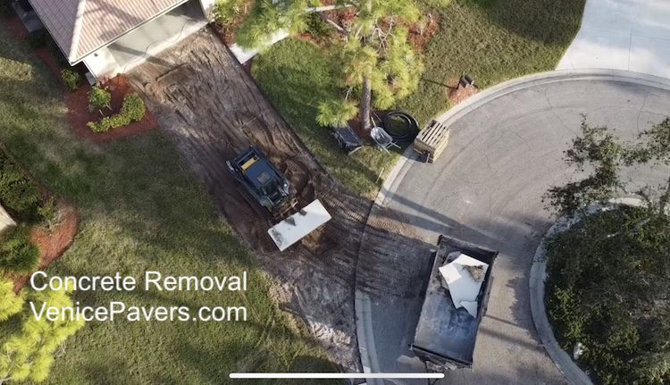 Concrete Removal 1 Concrete slab removal with skid steer in Venice Florida
