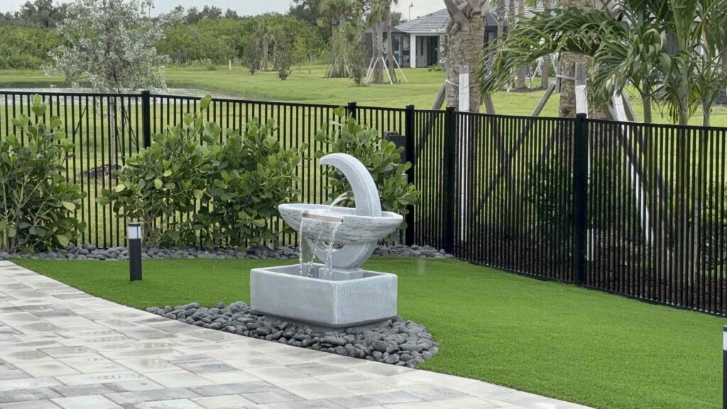 Pavers and Patios with Artificial Turf and Water Feature